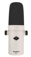 White studio microphone with black foam windscreen and two side adjustment knobs