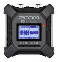 Black and gray Zoom F3 Field Recorder with display showing waveforms and control buttons visible.