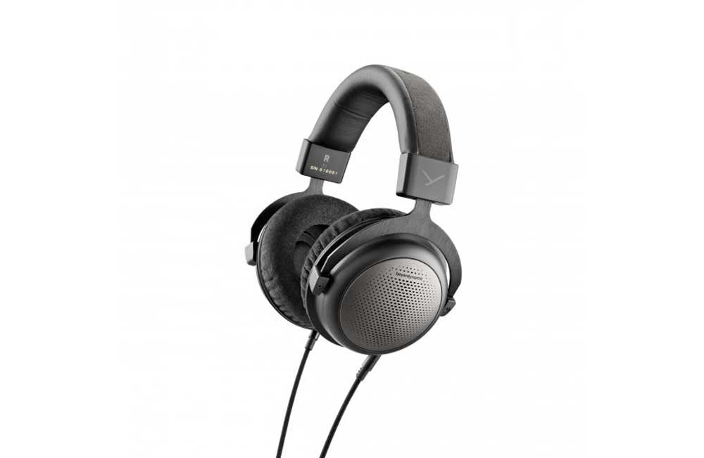 Black over-ear headphones with circular ear cushions and wired cables, shown from an angled front view.