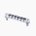 Chrome metal roller Tune-o-matic bridge with screw knobs on a white background.