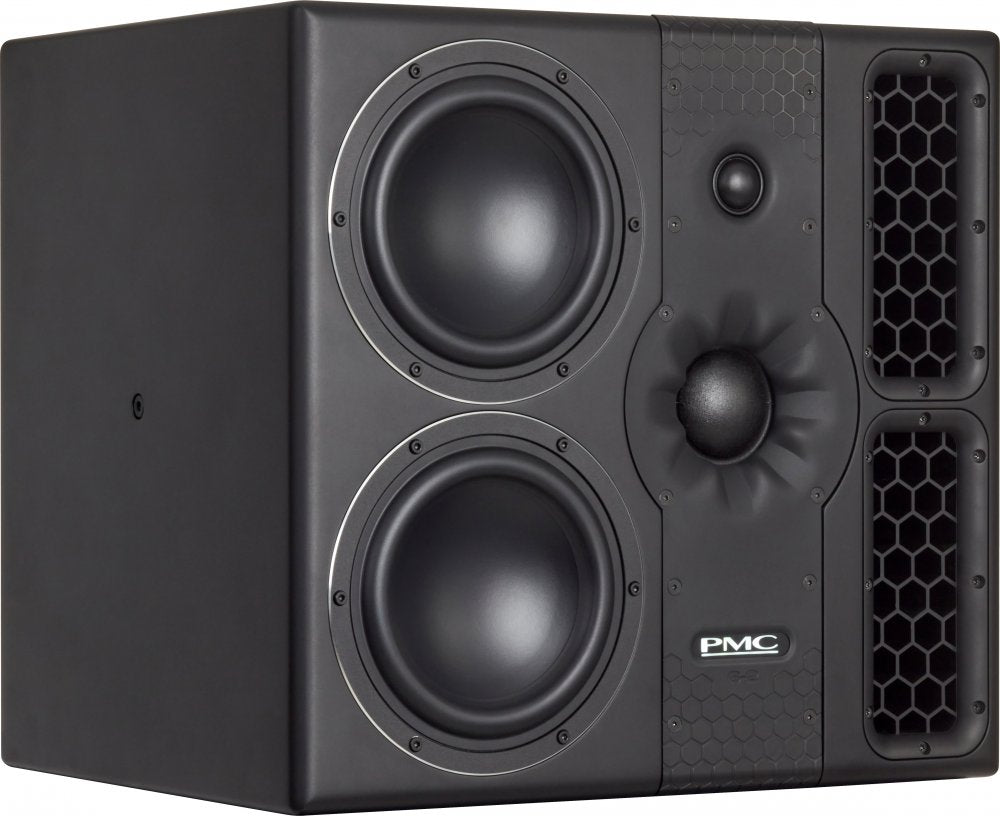 Black studio monitor speaker with two large woofers, a central tweeter, and two honeycomb-patterned bass ports.