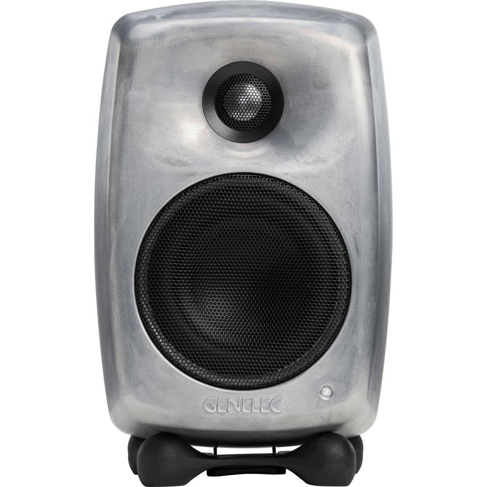 Front view of a silver raw metal active studio monitor speaker with black speaker grilles and isolating stand.