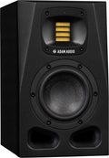 Black studio monitor speaker with yellow tweeter and large woofer, labeled ADAM AUDIO.