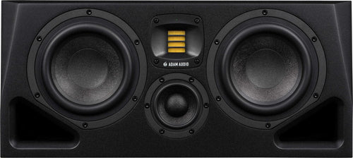 Front view of a black speaker with two large woofers, a small tweeter, and a yellow ribbon tweeter between them.