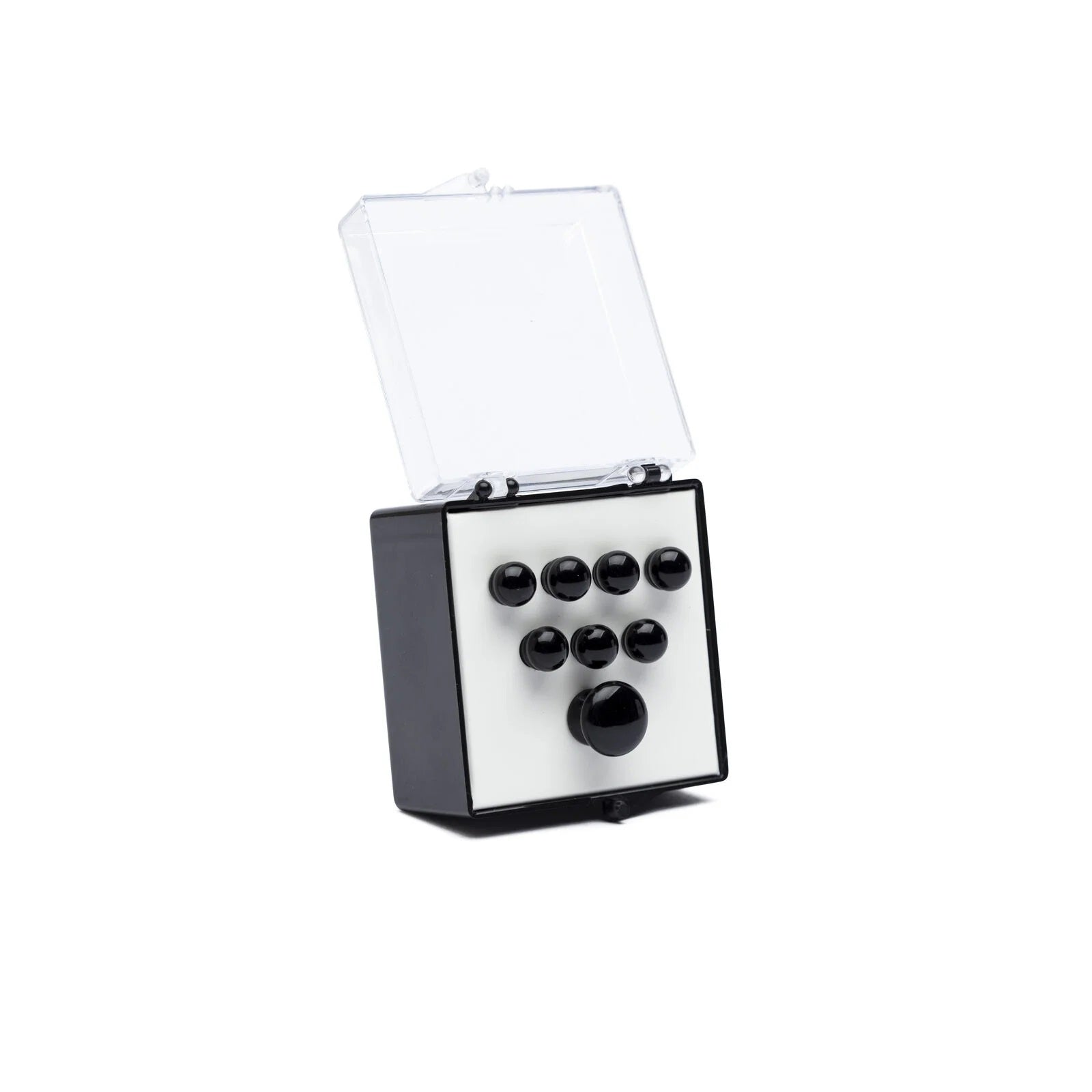 Small open box containing eight black round pins arranged on a white base inside a clear lid.