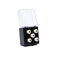 Five white knobs with black centers displayed on a black mount inside a clear hinged plastic box.