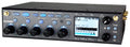 Front view of a black audio mixer device with buttons, knobs, screen, and antenna connectors on each side.