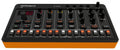 Black and orange Roland T-8 drum machine with buttons, knobs, and a digital display on top.