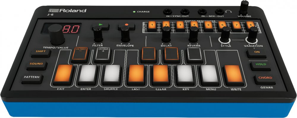 Roland J-6 synthesizer with buttons, knobs, LED display, and audio jacks on top panel