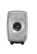 Front view of a gray Genelec speaker with a single centered driver and a green indicator light on the left.