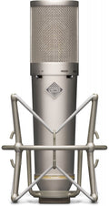 Silver studio microphone with mesh grille and shock mount holder visible from front.