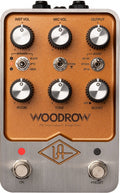 Top view of an orange and silver audio effects pedal with knobs, switches, and footswitches labeled Woodrow 55 Instrument Amplifier.