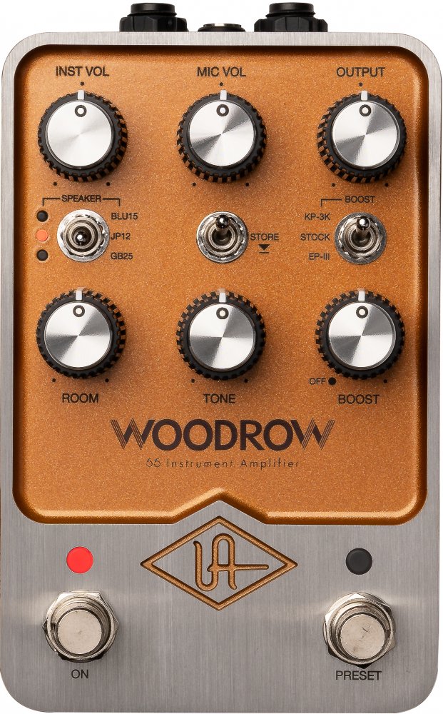 Top view of an orange and silver audio effects pedal with knobs, switches, and footswitches labeled Woodrow 55 Instrument Amplifier.