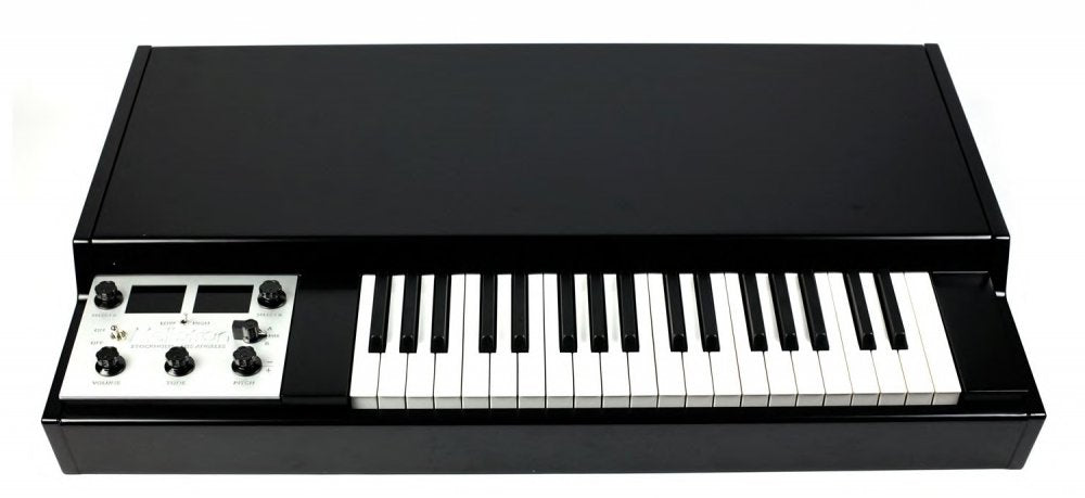 Black keyboard synthesizer with white and black keys and a control panel with knobs and buttons on the left side.