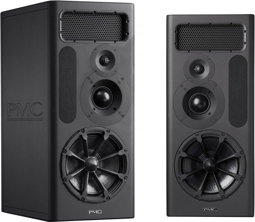 Two black PMC studio monitor speakers shown from front and angled front view.
