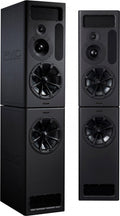 A matched pair of PMC MB3S XBD-A studio monitors in black, each a tall two-box stack: an upper main cabinet with a large 12-inch woofer, a midrange dome, a small tweeter and a slotted transmission-line vent, sitting on a lower XBD bass cabinet holding a second 12-inch woofer, with the embossed PMC logo on the side panel.