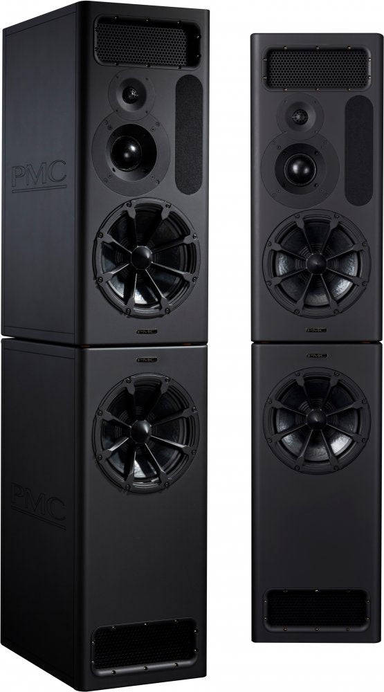 A matched pair of PMC MB3S XBD-A studio monitors in black, each a tall two-box stack: an upper main cabinet with a large 12-inch woofer, a midrange dome, a small tweeter and a slotted transmission-line vent, sitting on a lower XBD bass cabinet holding a second 12-inch woofer, with the embossed PMC logo on the side panel.