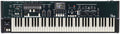 Black keyboard synthesizer with multiple control knobs, buttons, and sliders above the keys and a small screen