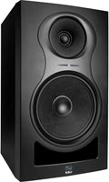Black studio monitor speaker with two drivers and a blue LED indicator light on the front panel.