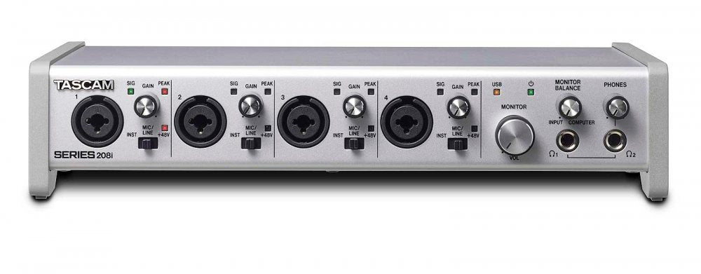 Silver audio interface with four combo inputs, gain controls, monitor and headphone outputs.