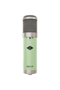 Light green and silver studio microphone with mesh grille and small slider switch visible on the front.