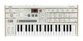 Top-down view of a white KORG microKORG S synthesizer keyboard with various knobs, buttons, and a small display screen.