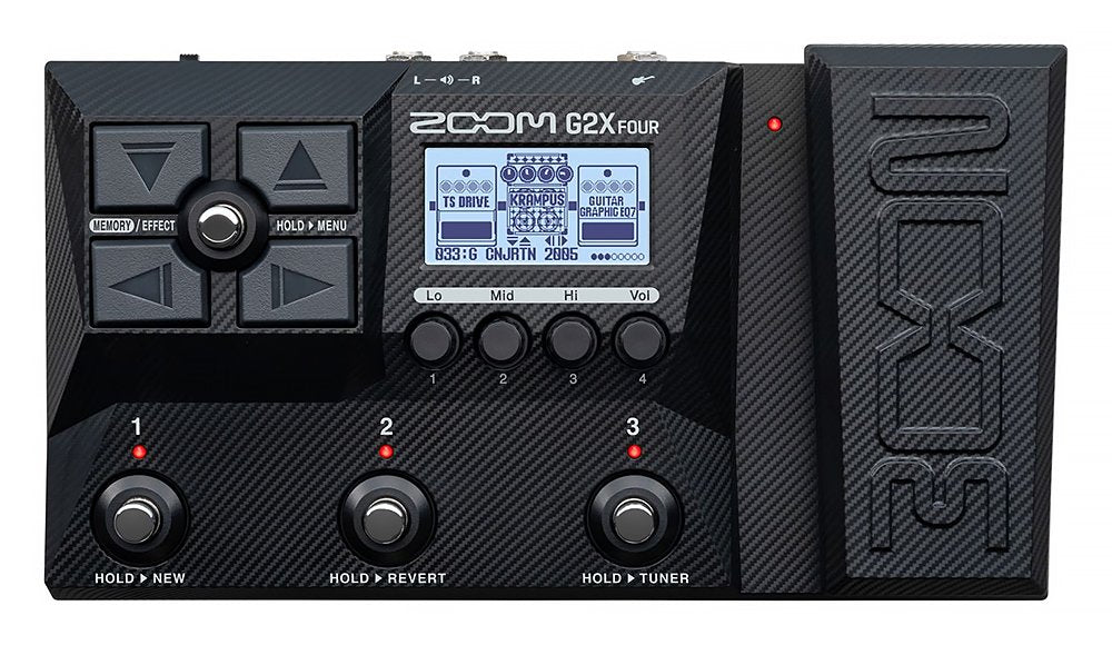 Black Zoom G2X Four multi-effects pedal with LCD display, knobs, footswitches, and directional buttons.