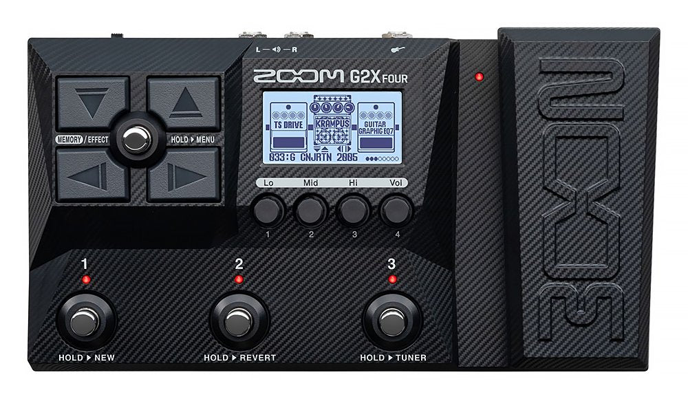 Black Zoom G2X Four multi-effects guitar pedal with display, knobs, buttons, and expression pedal.