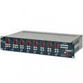 Metal audio equipment rack unit with multiple red and gray knobs, buttons, and a 1/4 inch jack on the front panel.