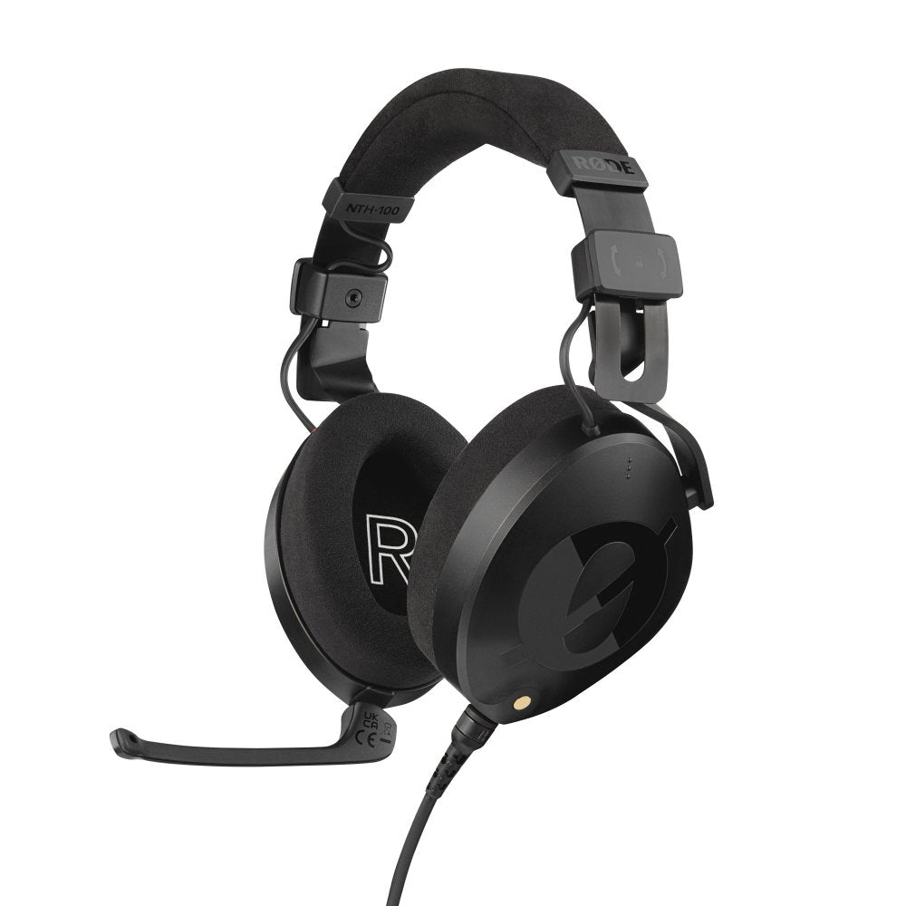Black over-ear headphones with adjustable headband and attached microphone boom arm connected by cable.