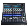Black audio mixer with dual display screens, multiple faders, knobs, and buttons labeled for various channels and functions.