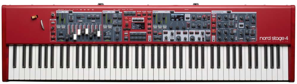 Red synthesizer keyboard with multiple control panels, sliders, knobs, buttons, and a display screen.