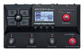 Top view of a black ZOOM B2 Four multi-effects pedal with various buttons, knobs, footswitches, and a display screen.
