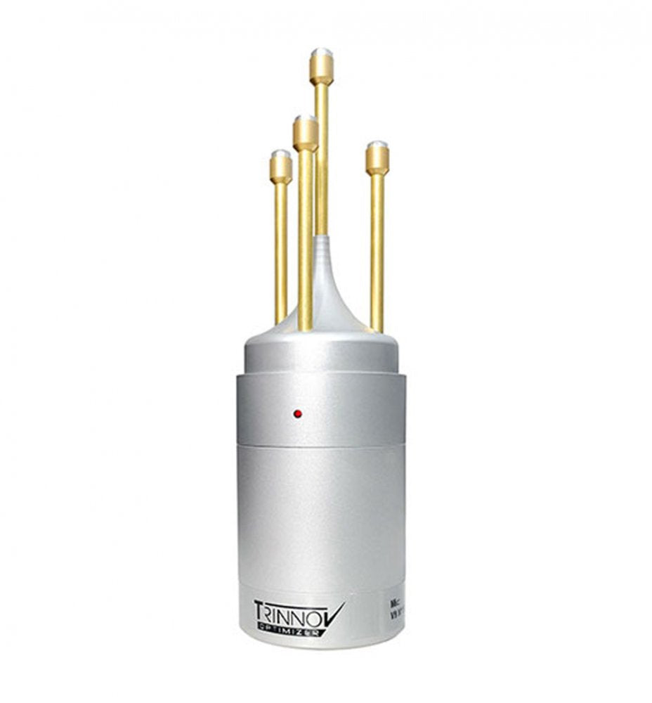 Silver cylindrical audio device with four vertical gold rods and a small red indicator light on the front.