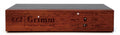 Front view of a wooden master clock device with branding and two toggle switches for frequency selection.