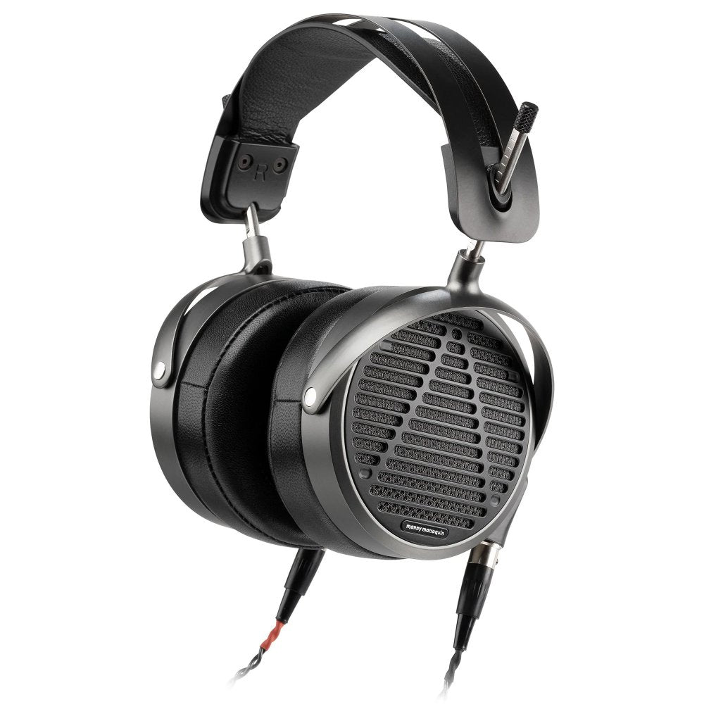 Open-back over-ear headphones with black ear cushions, metal frame, and visible audio cables connected.