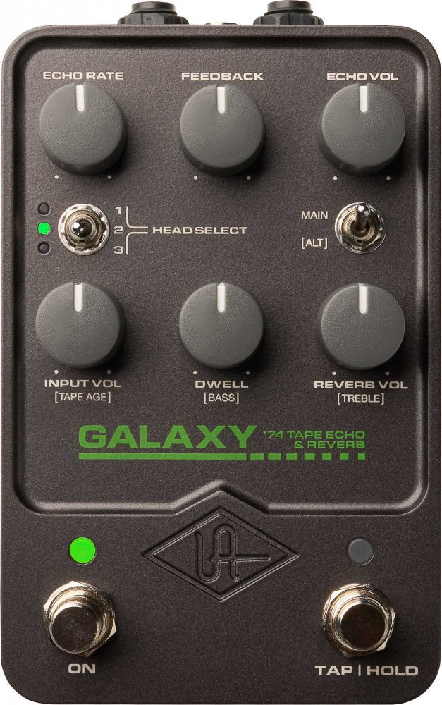 Black guitar effects pedal with six control knobs, two toggle switches, and two footswitches with green indicator lights.
