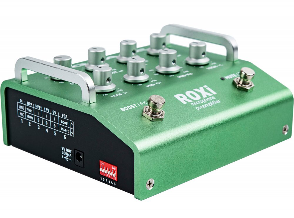 Green metal preamplifier unit with multiple control knobs, toggle and footswitches, and a power input connector.
