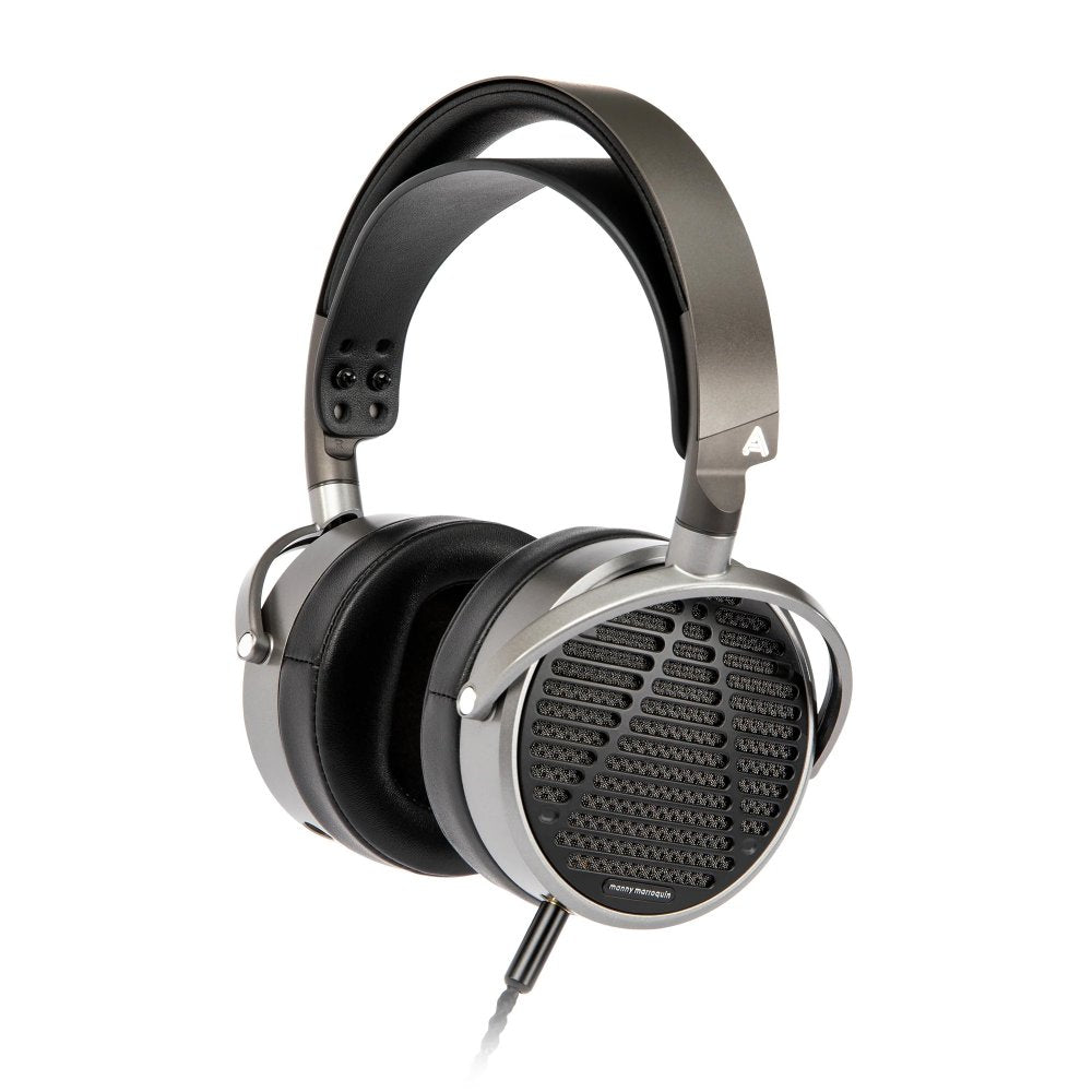 Over-ear wired headphones with grey and black color and perforated ear cups showing a grille design.