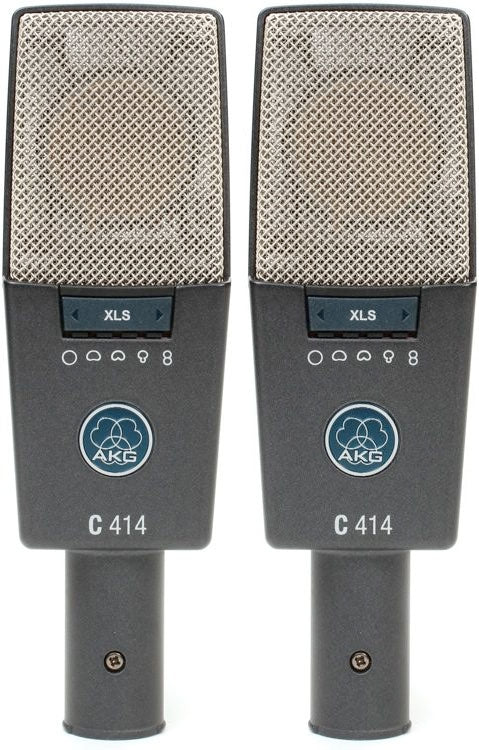 Two gray AKG C 414 microphones with metal mesh heads, controls, and connectors shown side by side.