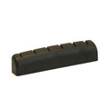 Black slotted guitar nut with six string slots, viewed at an angle on a white background.