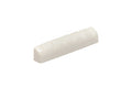 Off-white slotted nut for stringed instrument with six grooves on top.