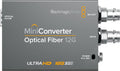 Gray Blackmagicdesign Mini Converter with optical fiber port and two BNC connectors for SDI input and output.