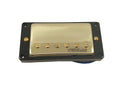Gold covered guitar pickup with black mounting frame and visible adjustment screws.