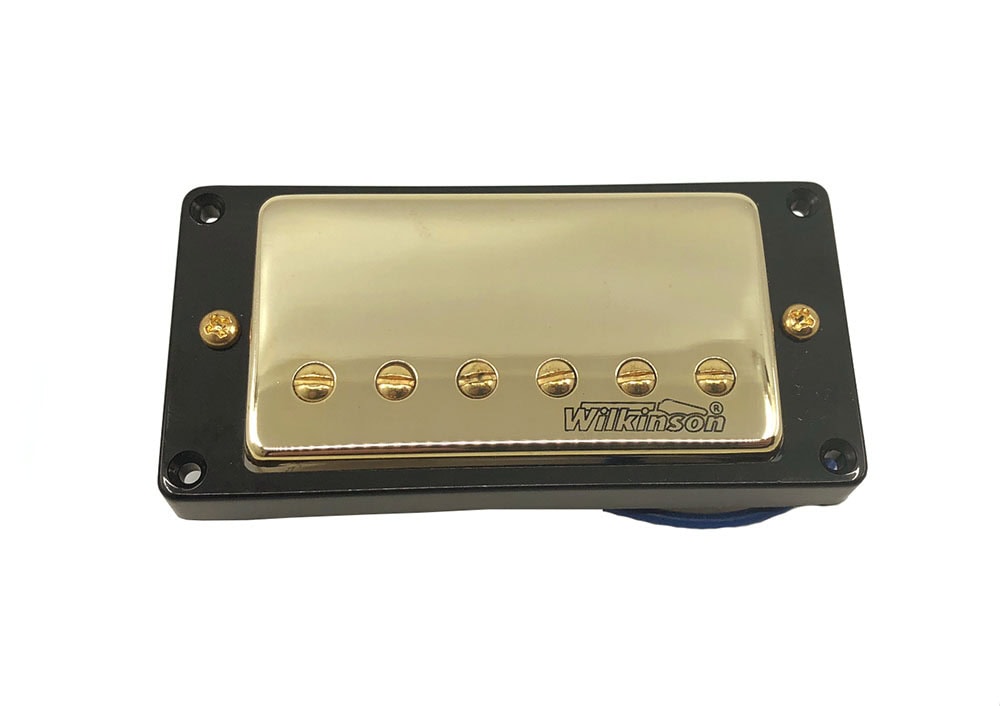 Gold covered guitar pickup with black mounting frame and visible adjustment screws.