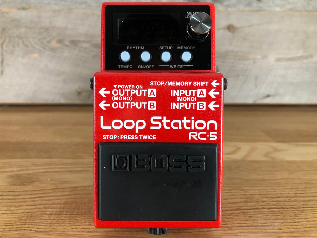 Red Boss Loop Station RC-5 guitar pedal with footswitch, control knob, buttons, and input/output jacks.