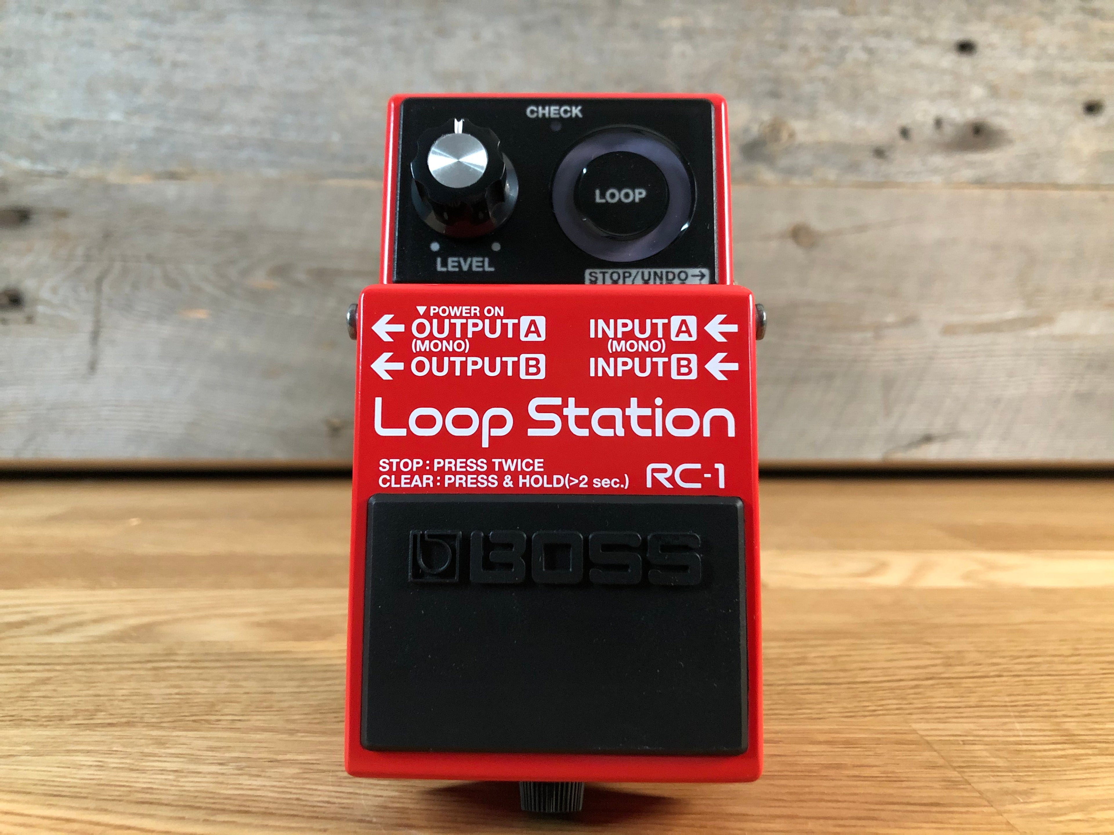 Red Boss RC-1 Loop Station guitar pedal with one knob, footswitch, and input/output jacks.