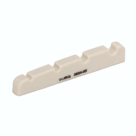 Off-white 4-string bass guitar nut with five slots and TUSQ 3834-00 printed on side.