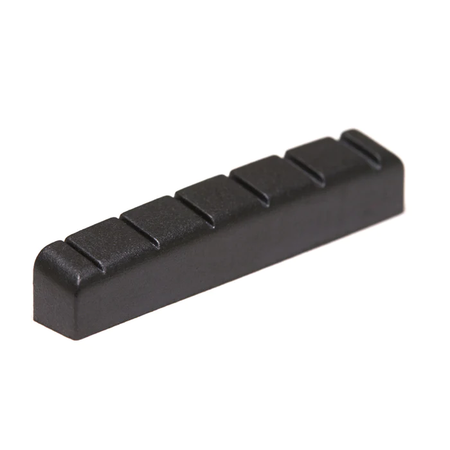 Black slotted plastic guitar nut with six slots, viewed at an angled perspective on a white background.