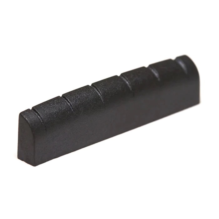 Black slotted guitar nut with six string grooves.
